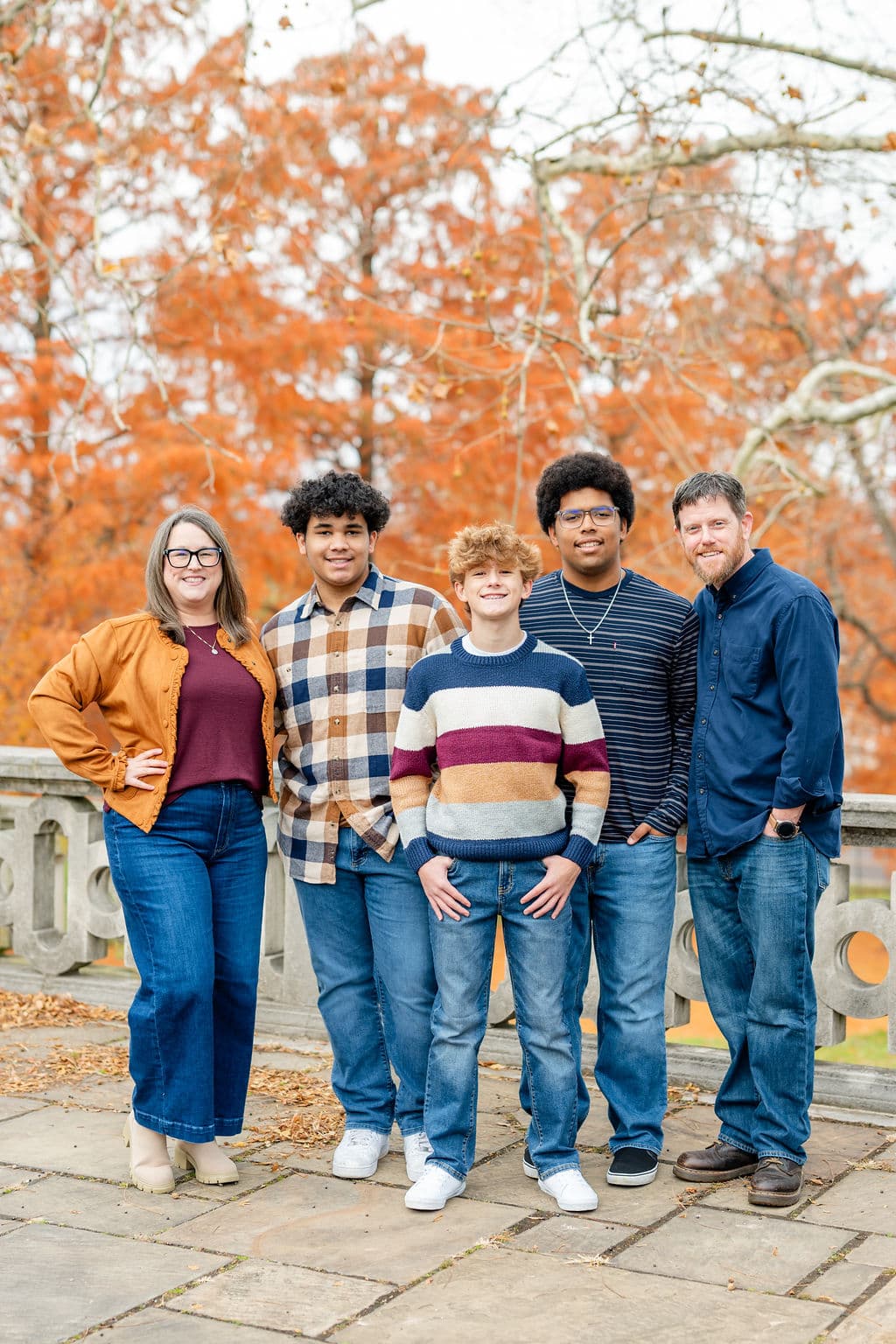 Fall family portraits at a Pittsburgh-area park during peak autumn foliage and golden light